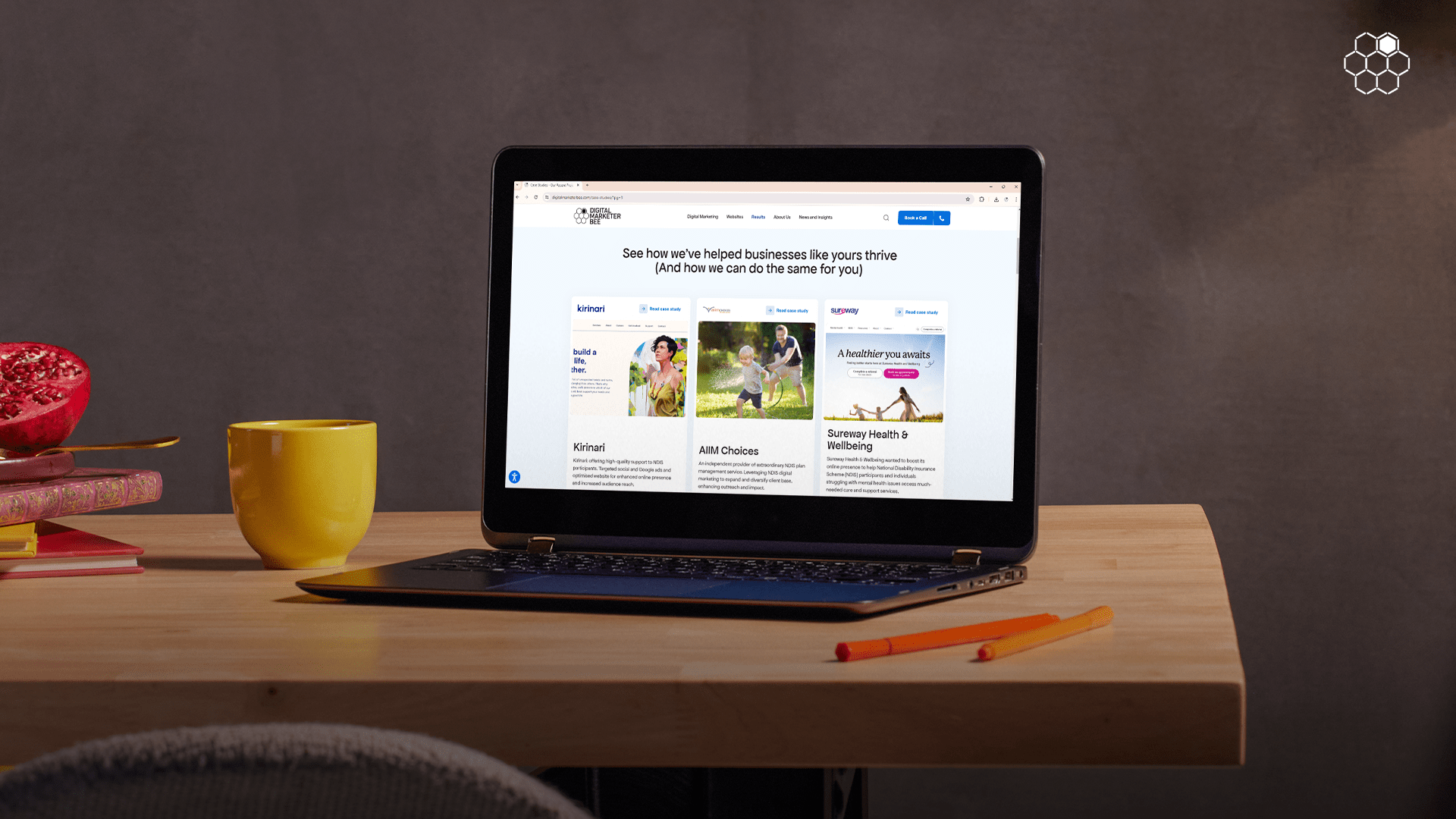 laptop on top of the table showing a well-built website